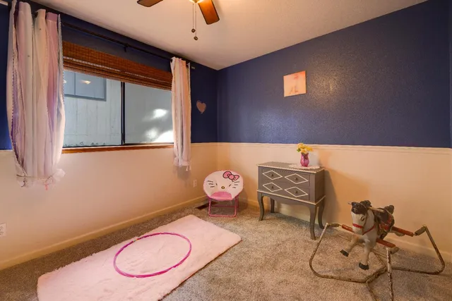 a bathroom with a sink mirror and toilet