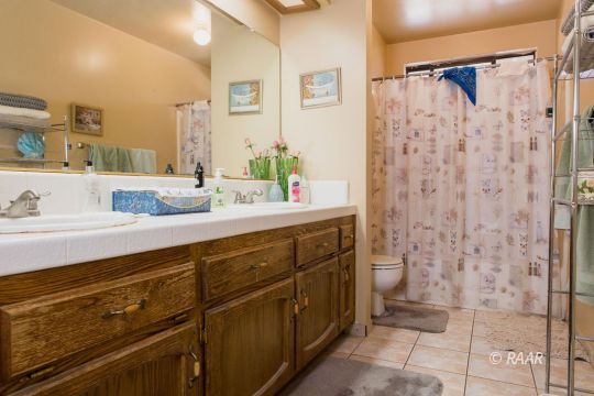 600 Beth Lane Ridgecrest, CA 93555 - Photo 20 of 25 a bathroom with a sink and a mirror