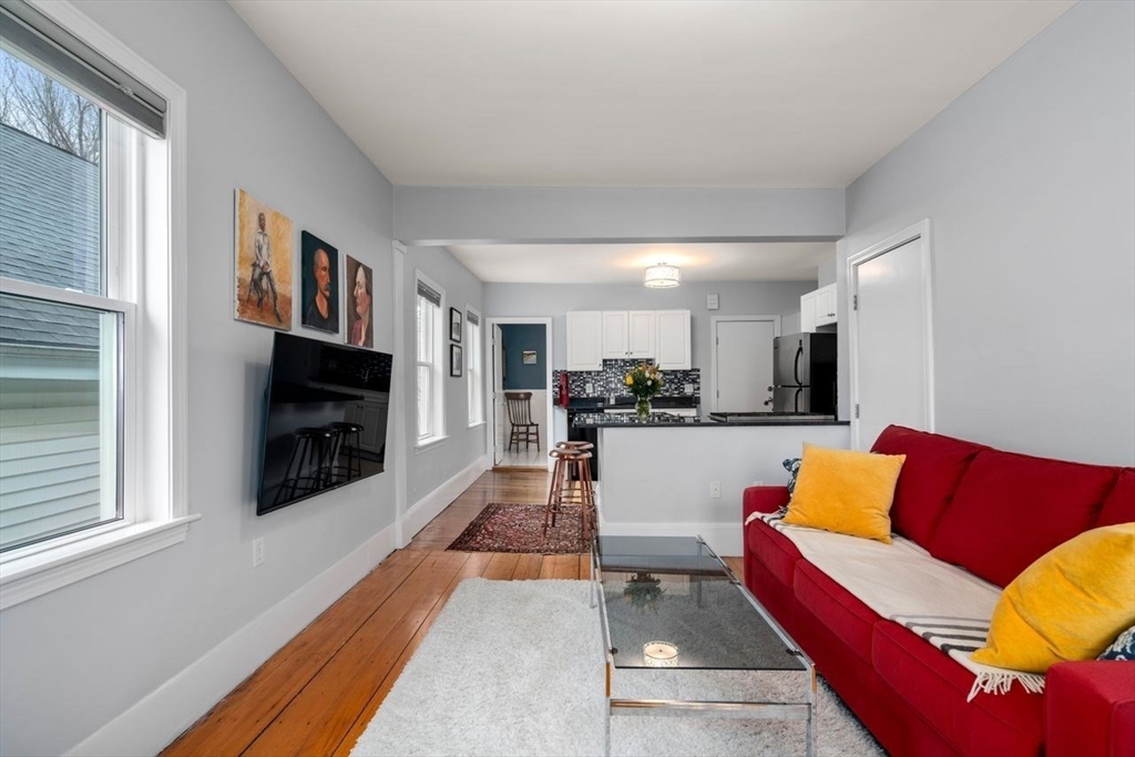 26 Armstrong Street, Unit 3 Boston, MA 02130 - Photo 5 of 17 a living room with furniture fireplace and flat screen tv