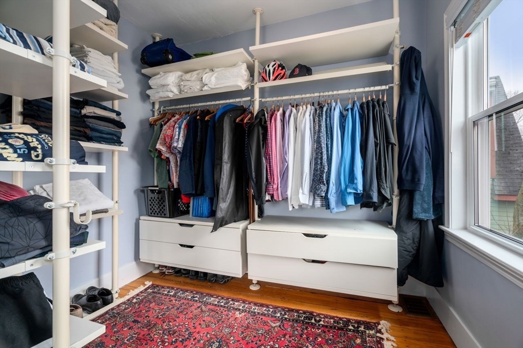 26 Armstrong Street, Unit 3 Boston, MA 02130 - Photo 7 of 17 a view of walk in closet with clothes and shoes