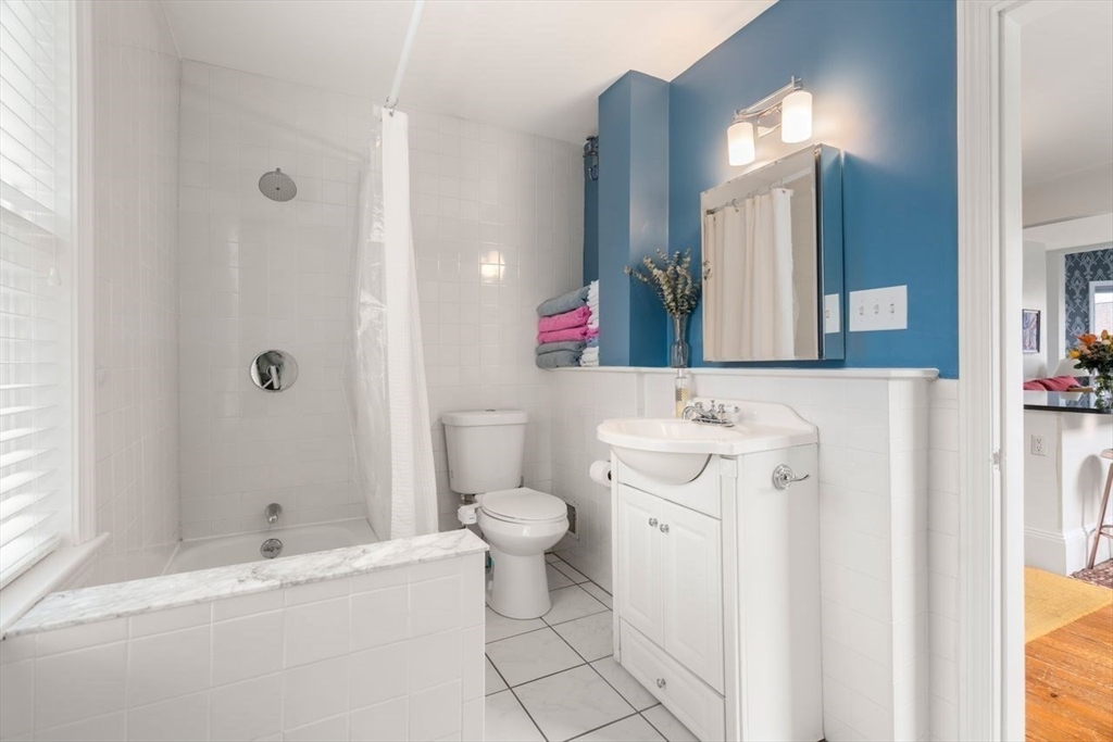 26 Armstrong Street, Unit 3 Boston, MA 02130 - Photo 9 of 17 a bathroom with a sink a toilet and shower