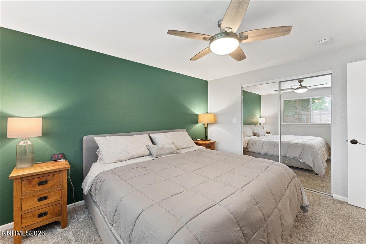 2205 Carlin Street Reno, NV 89503 - Photo 19 of 51 a bedroom with a bed and a chandelier