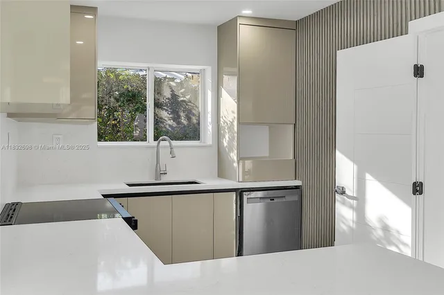 a kitchen with a sink and a window