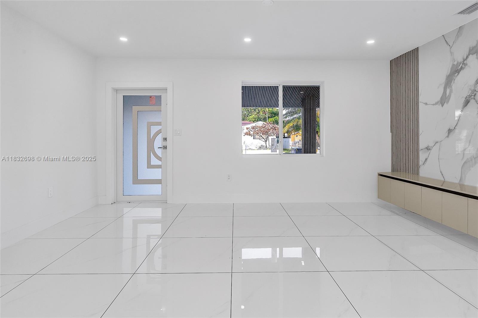 6540 Southwest 25th Street Miami, FL 33155 - Photo 2 of 37 a view of an empty room with a window