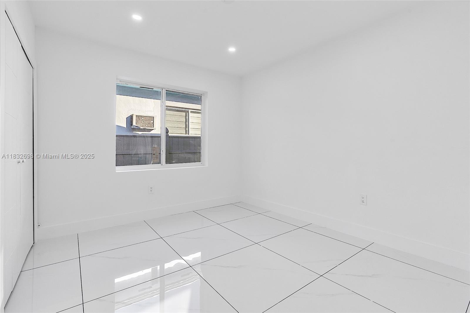 6540 Southwest 25th Street Miami, FL 33155 - Photo 23 of 37 a view of an empty room with a window