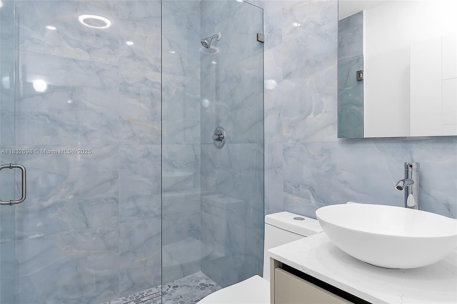 6540 Southwest 25th Street Miami, FL 33155 - Photo 24 of 37 a bathroom with a sink a toilet and shower