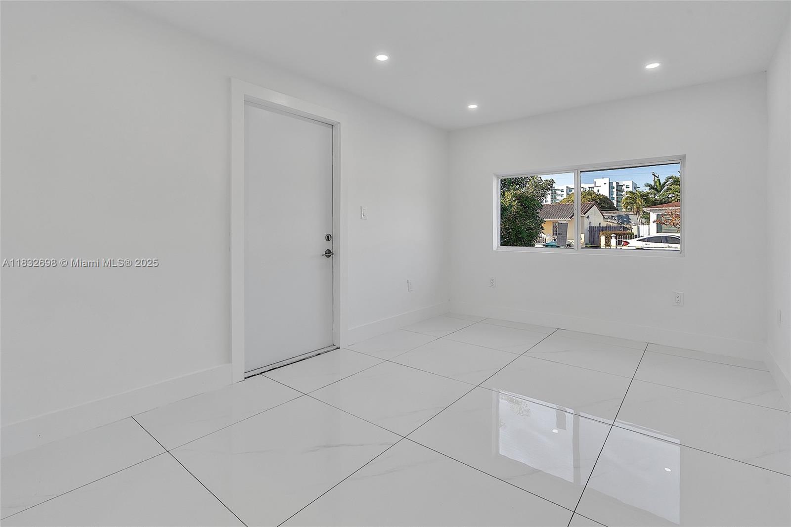 6540 Southwest 25th Street Miami, FL 33155 - Photo 27 of 37 a view of an empty room with a window