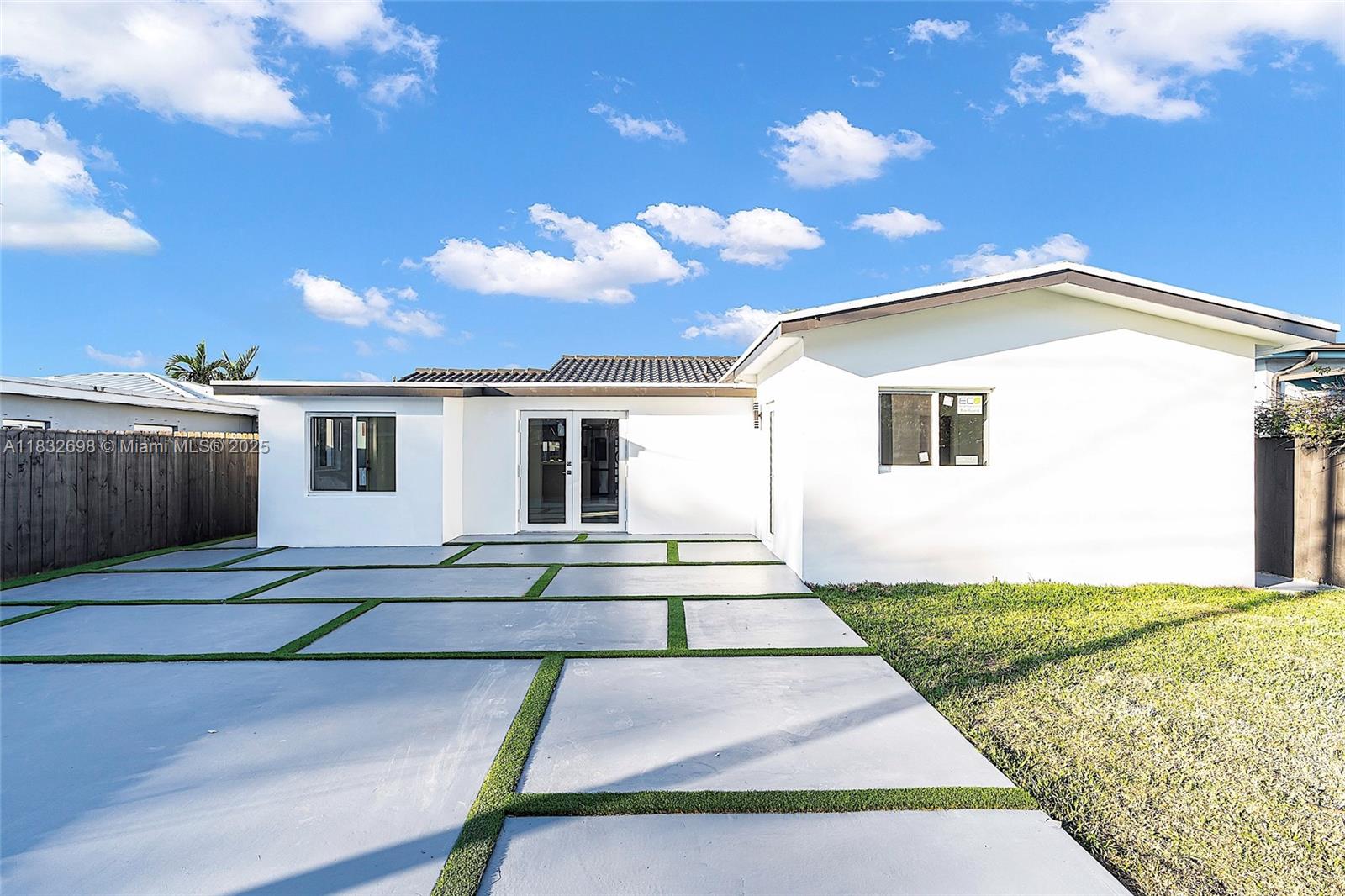 6540 Southwest 25th Street Miami, FL 33155 - Photo 30 of 37 a front view of a house with a yard