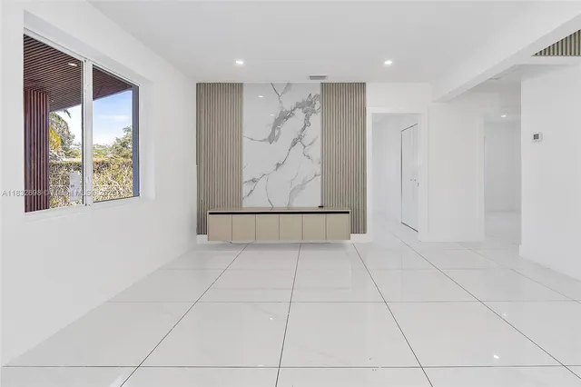 a view of room with window and hallway