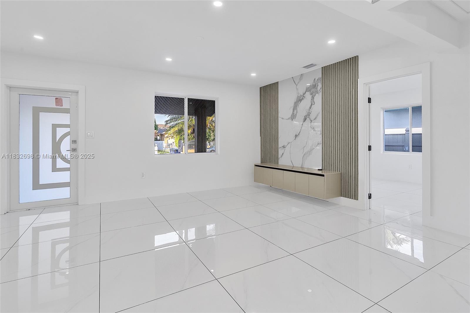 6540 Southwest 25th Street Miami, FL 33155 - Photo 4 of 37 a view of an empty room with window and bathroom