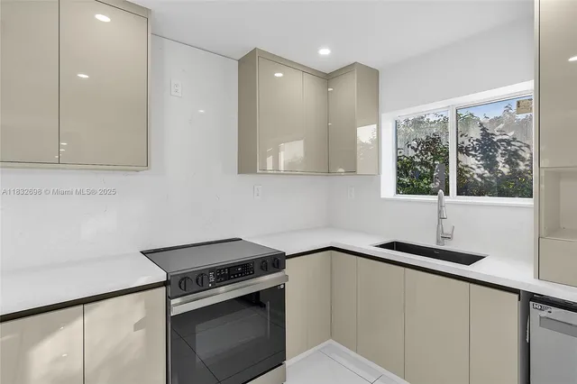 a kitchen with a sink and a window