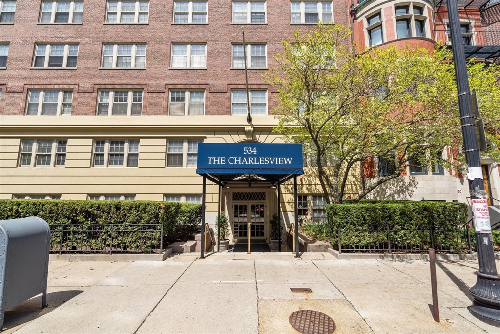 534 Beacon Street, Unit 707 Boston, MA 02215 - Photo 14 of 16 a front view of a building with a garden and plants