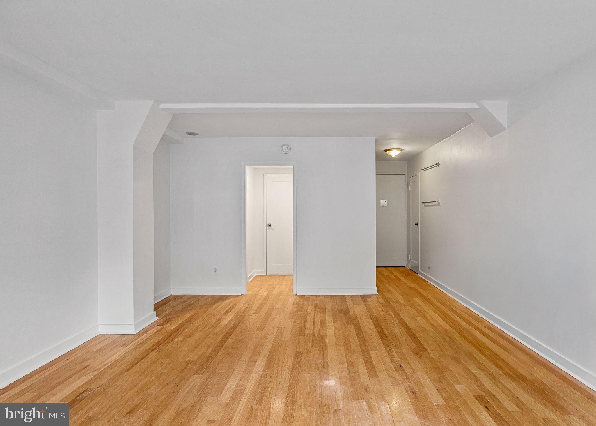 1810 Rittenhouse Square, Unit 203 Philadelphia, PA 19103 - Photo 5 of 15 a view of empty room with wooden floor