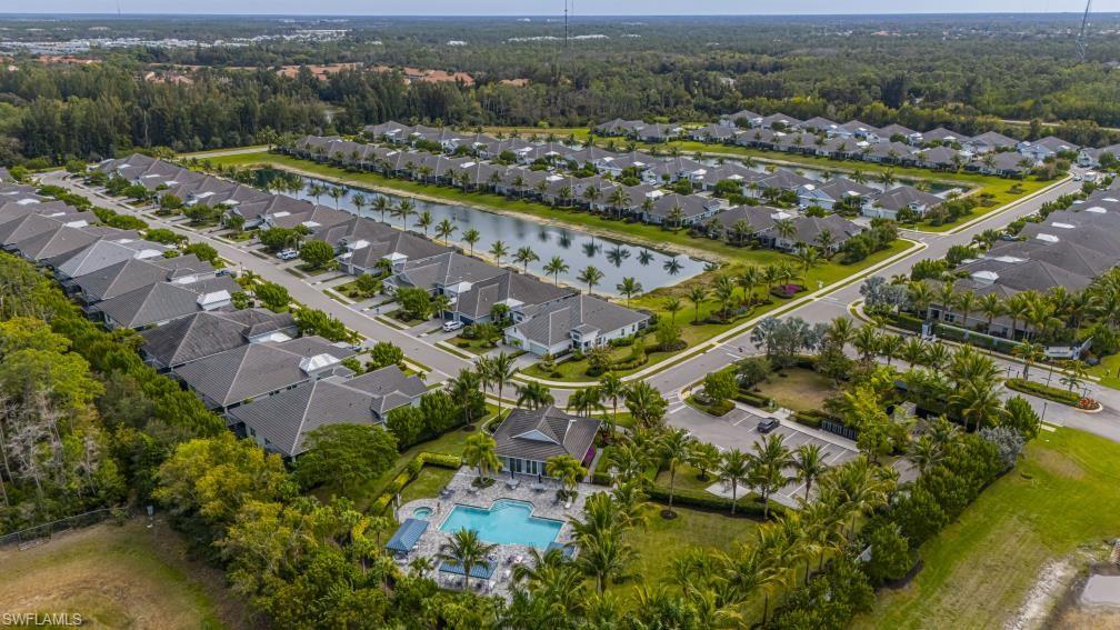 2199 Marquesa Circle Naples, FL 34112 - Photo 19 of 26 Aerial view of property and surrounding area featuring a nearby body of water and nearby suburban area