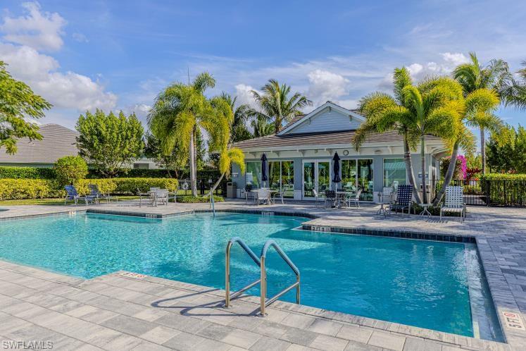 2199 Marquesa Circle Naples, FL 34112 - Photo 23 of 26 Community pool featuring a patio area