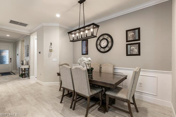 2199 Marquesa Circle Naples, FL 34112 - Photo 5 of 26 Dining room featuring crown molding, light wood-style flooring, and recessed lighting