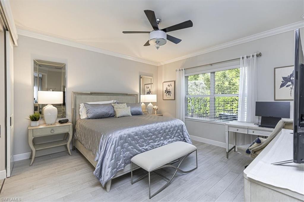 2199 Marquesa Circle Naples, FL 34112 - Photo 7 of 26 Bedroom with ornamental molding, light wood-style flooring, and a ceiling fan
