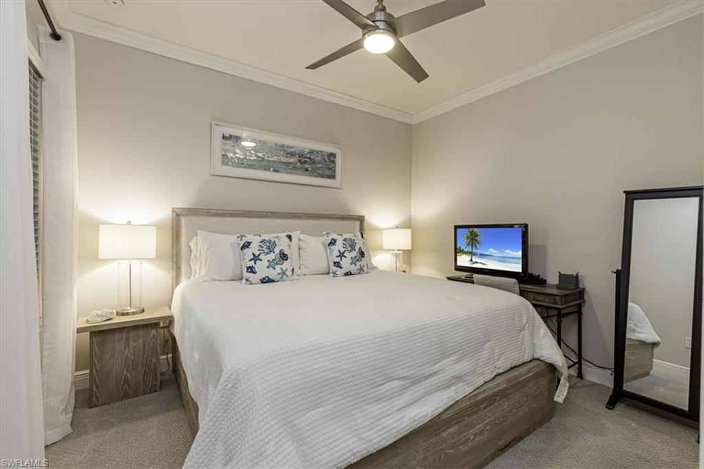 2199 Marquesa Circle Naples, FL 34112 - Photo 9 of 26 Carpeted bedroom with crown molding and ceiling fan