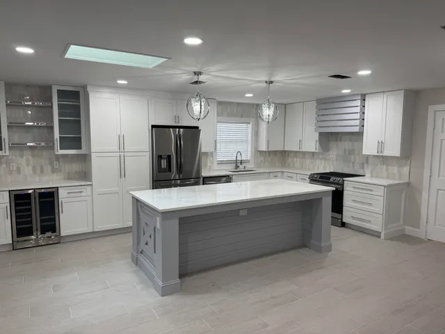 a kitchen with a stove and a refrigerator