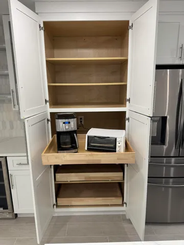 a view of storage and utility room with washer and dryer