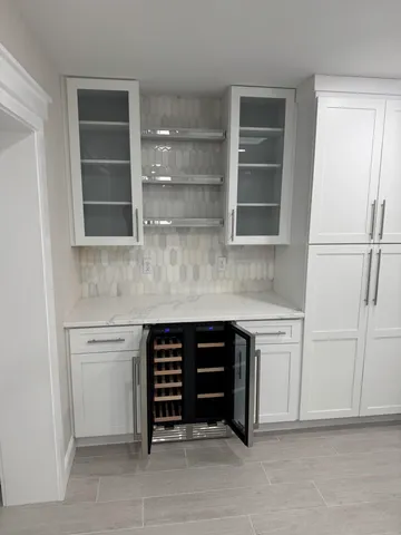 a view of swimming pool with a lounge chair and a porch