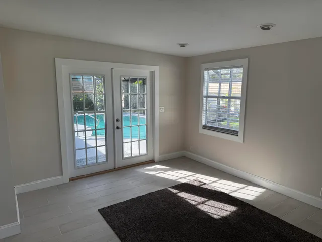 a kitchen with granite countertop cabinets stainless steel appliances and a window