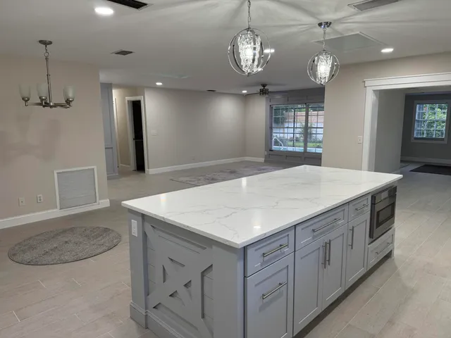 a view of a kitchen counter space with wooden floor