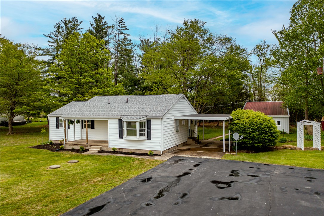 11296 Pansing Road Brookville, OH 45309 - Photo 47 of 53 This charming residence offers a peaceful retreat with a classic front porch and bay window.
