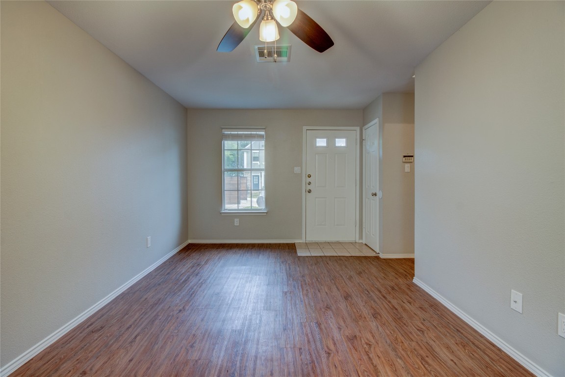 202 South College Street, Unit 8 Georgetown, TX 78626 - Photo 12 of 40 Foyer with wood finished floors and ceiling fan