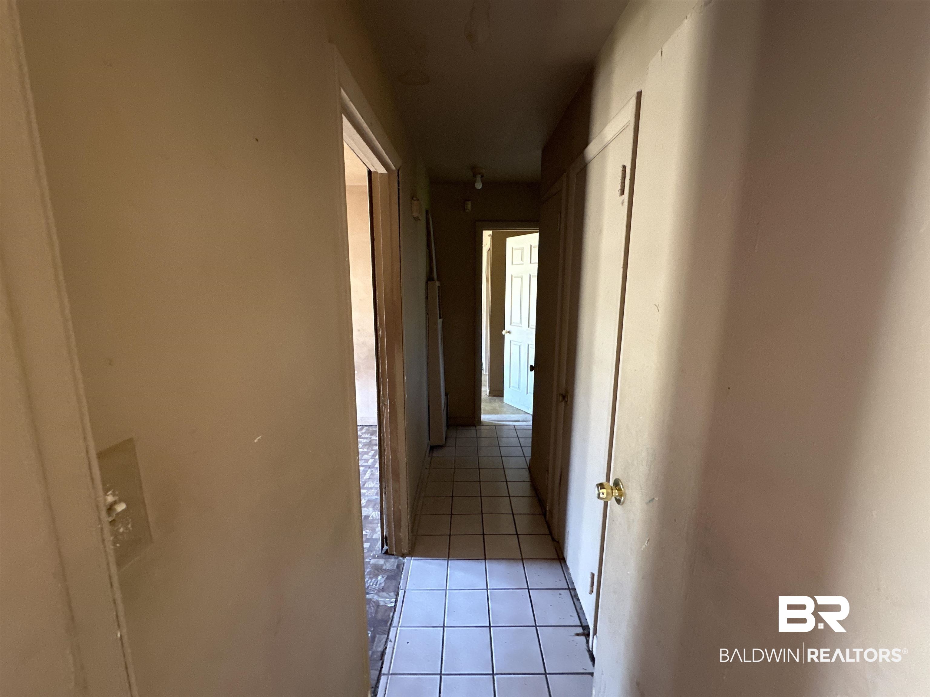 58 Chieftain Way Mobile, AL 36611 - Photo 10 of 12 Hall with light tile patterned floors