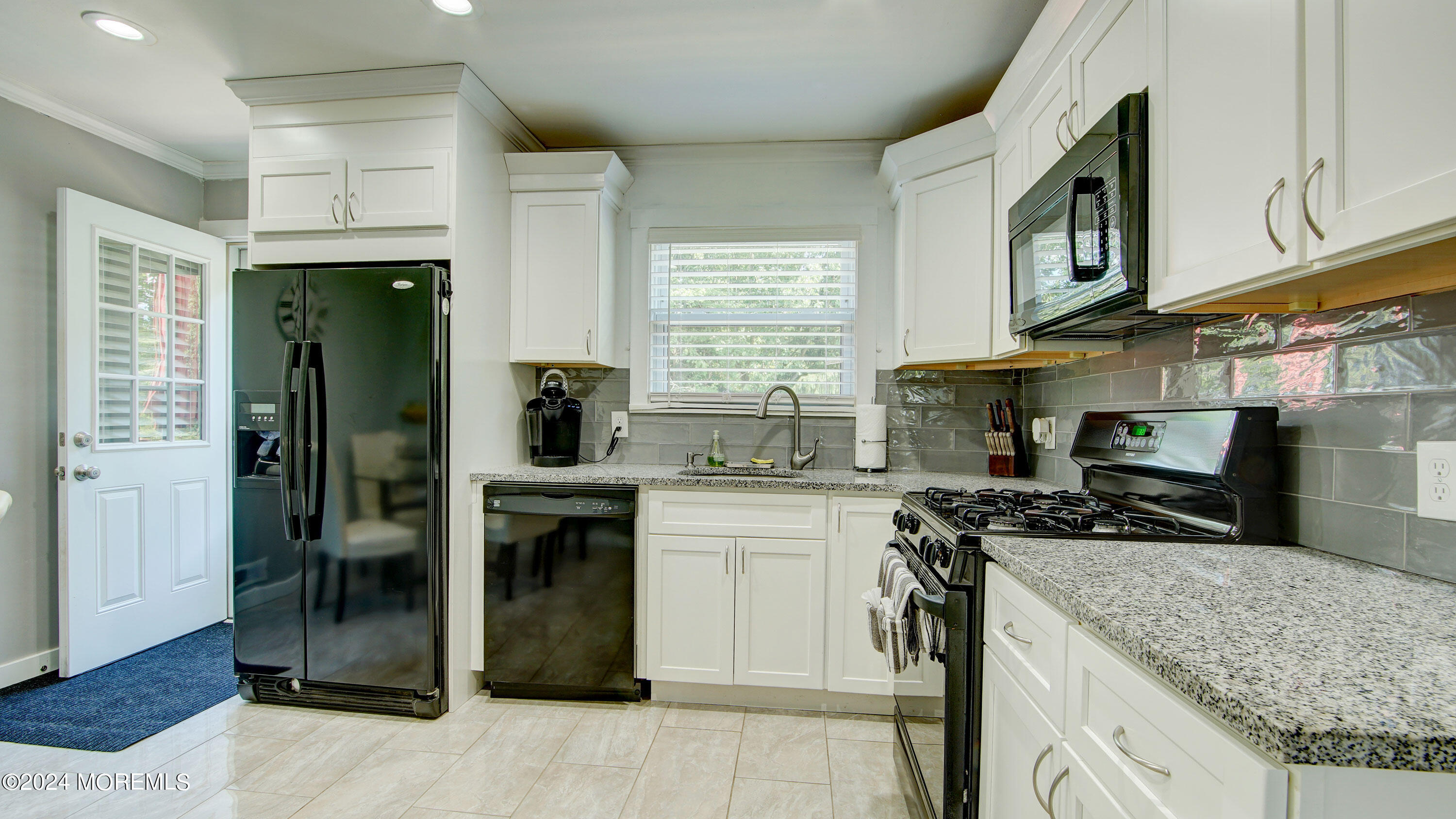 325 Aldrich Road Howell, NJ 07731 - Photo 5 of 19 a kitchen with stainless steel appliances granite countertop a refrigerator a stove and a sink
