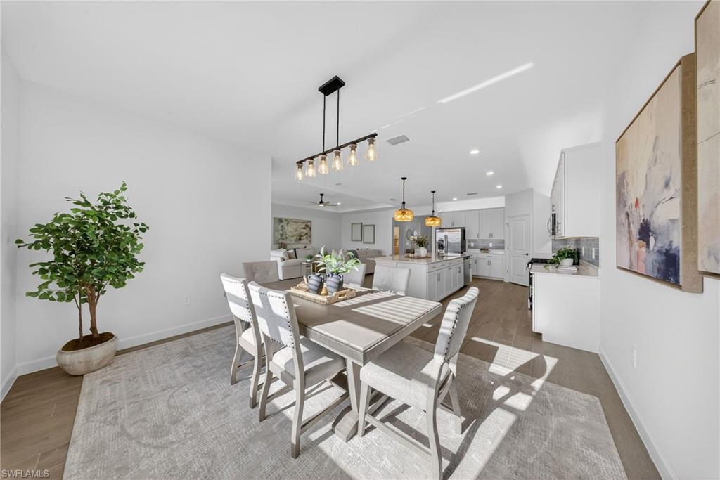 21082 Verawood Loop Estero, FL 33928 - Photo 14 of 50 a view of a dining room with furniture