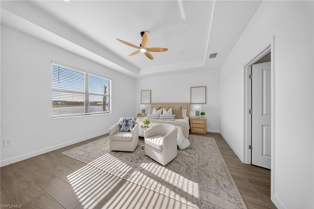 21082 Verawood Loop Estero, FL 33928 - Photo 18 of 50 a bedroom with a bed and a window