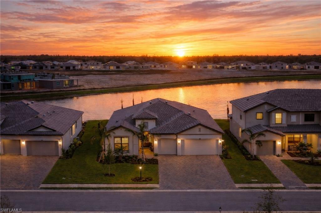 21082 Verawood Loop Estero, FL 33928 - Photo 2 of 50 an aerial view of residential houses with outdoor space and ocean view