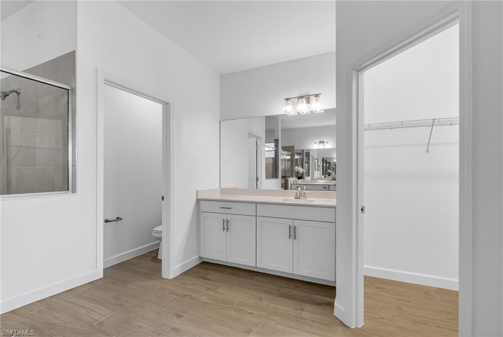21082 Verawood Loop Estero, FL 33928 - Photo 23 of 50 a spacious bathroom with a shower and a sink