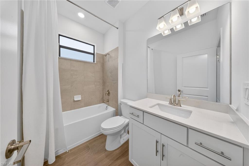 21082 Verawood Loop Estero, FL 33928 - Photo 27 of 50 a bathroom with a sink a toilet and shower