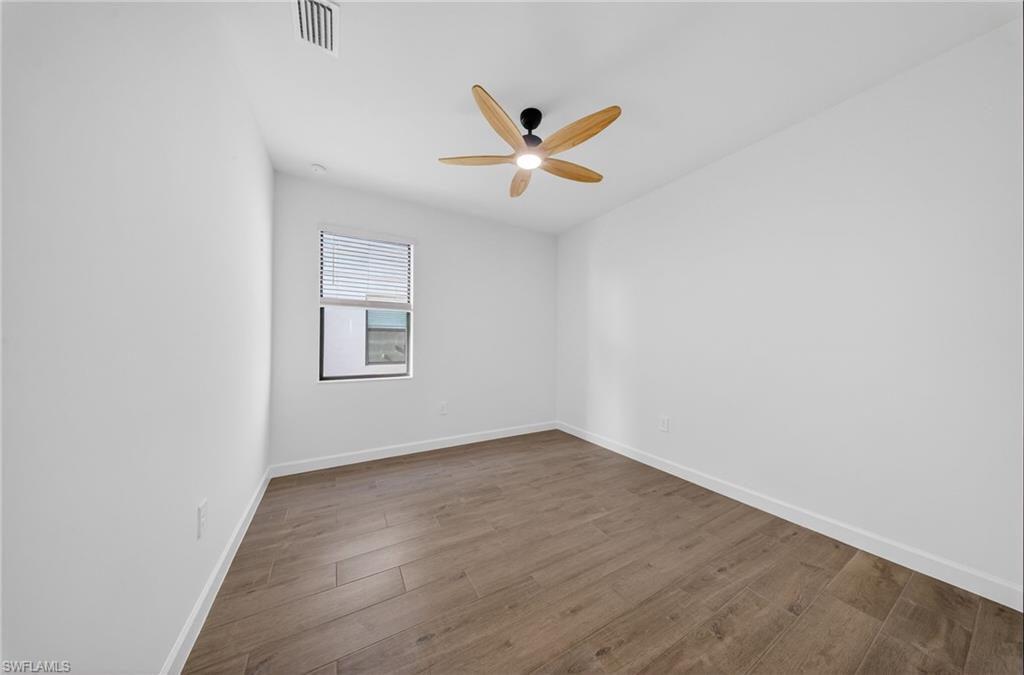 21082 Verawood Loop Estero, FL 33928 - Photo 28 of 50 an empty room with a window and ceiling fan