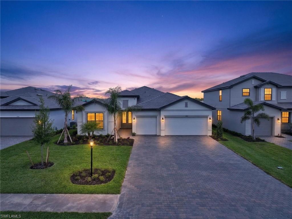 21082 Verawood Loop Estero, FL 33928 - Photo 34 of 50 a front view of a house with garden
