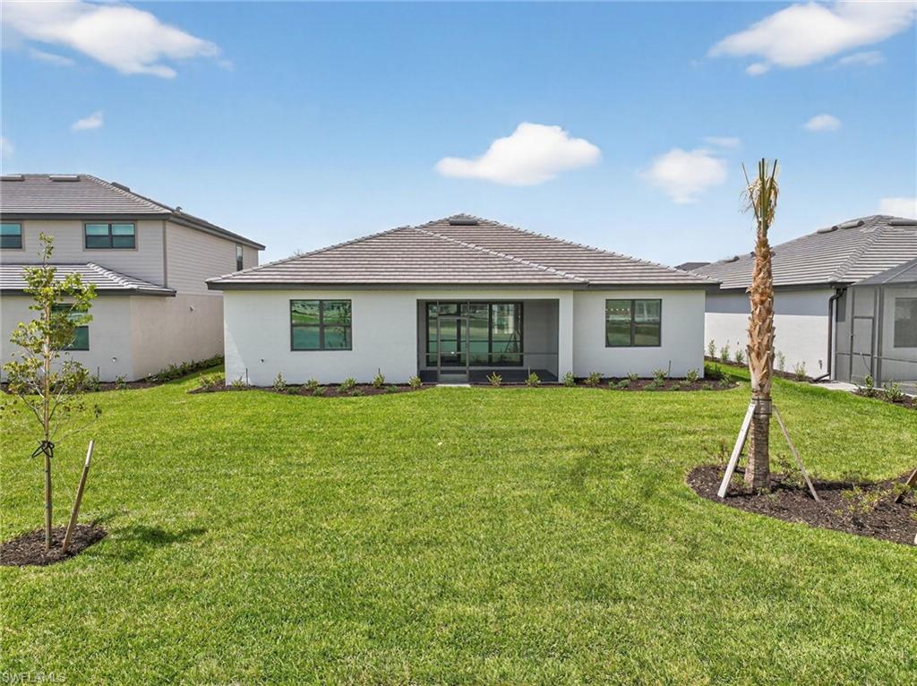 21082 Verawood Loop Estero, FL 33928 - Photo 37 of 50 a view of a house with a backyard