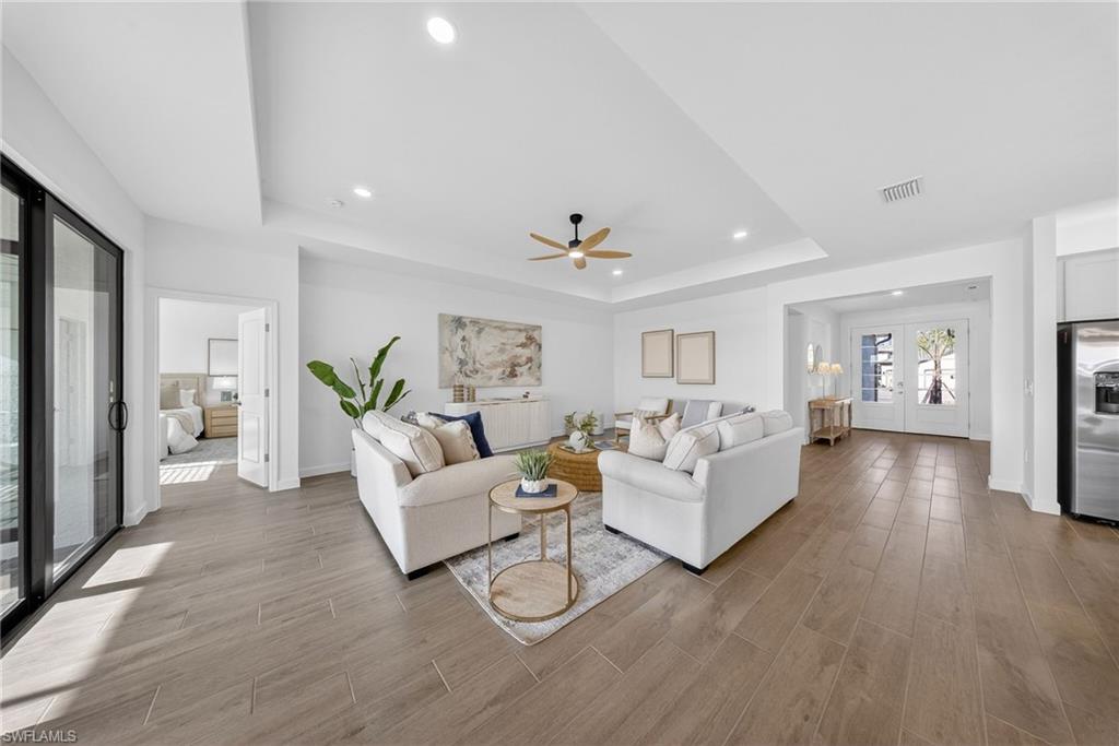 21082 Verawood Loop Estero, FL 33928 - Photo 4 of 50 a living room with furniture and a wooden floor