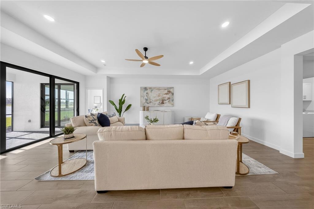 21082 Verawood Loop Estero, FL 33928 - Photo 5 of 50 a living room with furniture and large windows