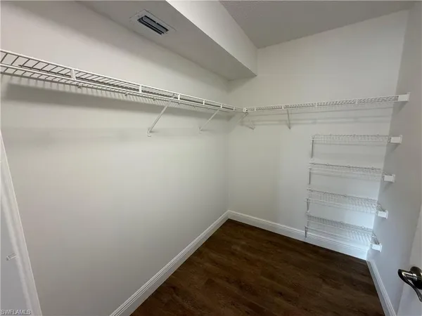 a view of a room with racks on the wall