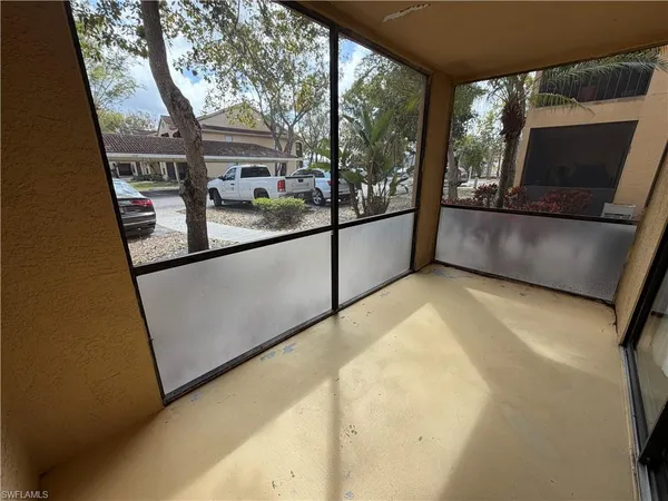 a view of a living room with a large window
