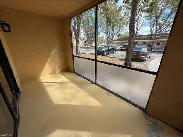 a view of a living room with a large window