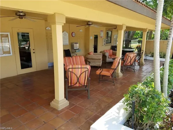 a view of a lobby with chair and floor to ceiling window