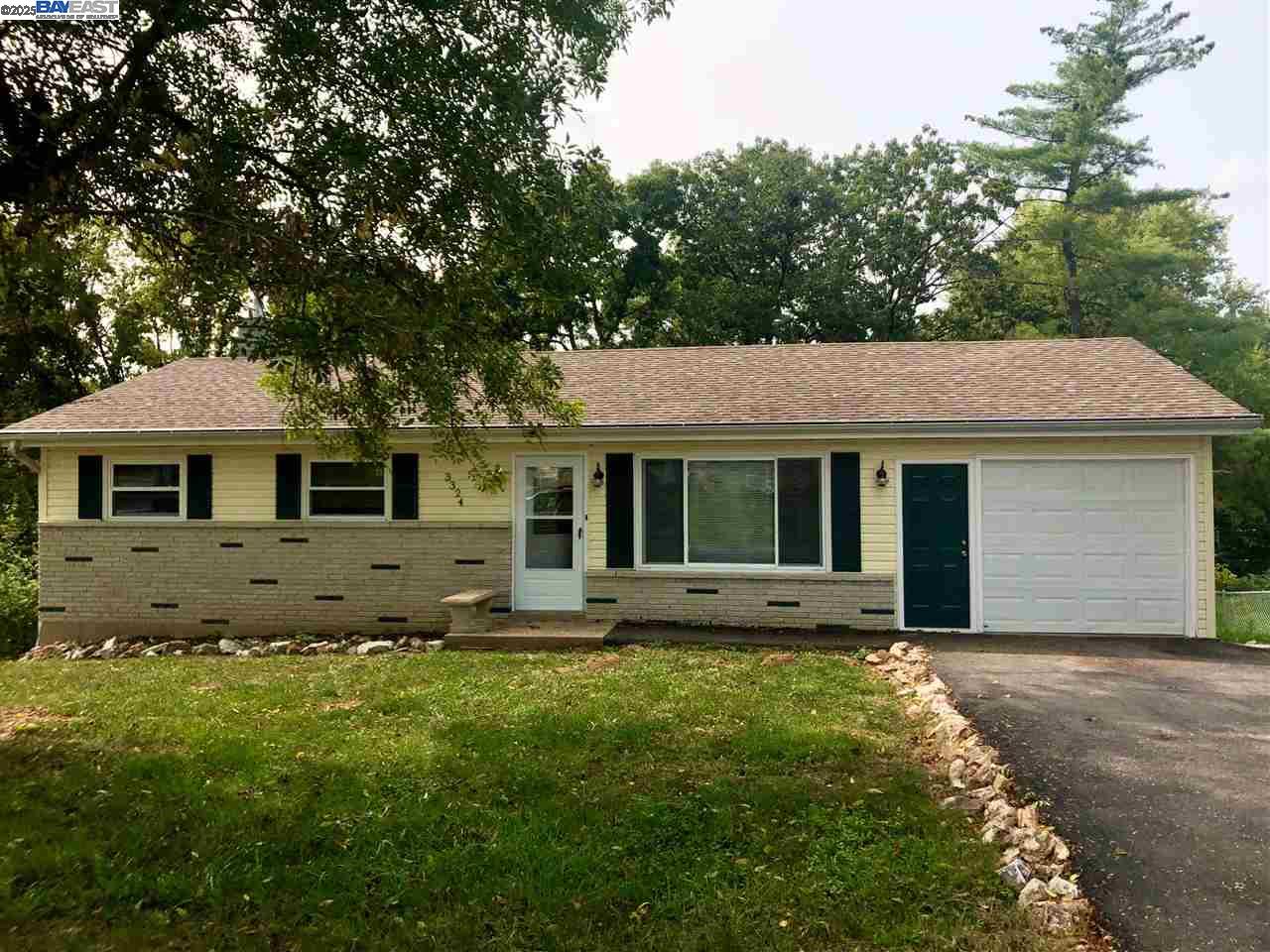 a front view of a house with yard