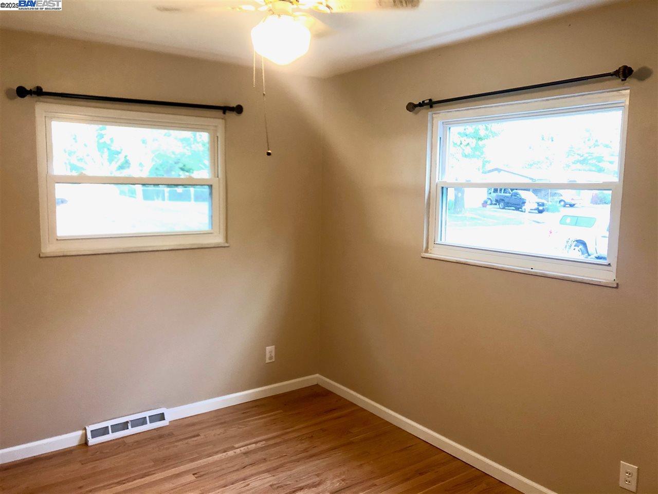 3324 Dale Drive Imperial, MO 63052 - Photo 12 of 14 an empty room with wooden floor and windows