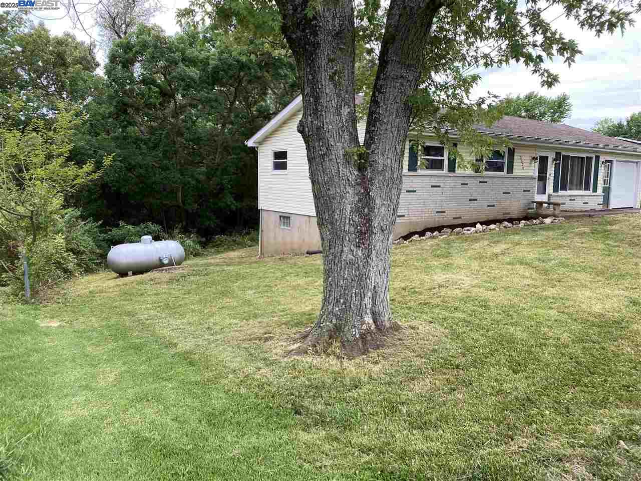 3324 Dale Drive Imperial, MO 63052 - Photo 3 of 14 a backyard of a house with table and chairs