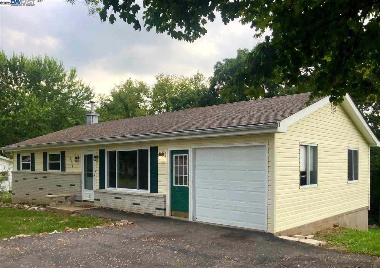 3324 Dale Drive Imperial, MO 63052 - Photo 4 of 14 a view of a white house with a large window and large tree