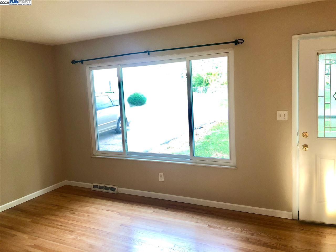 3324 Dale Drive Imperial, MO 63052 - Photo 8 of 14 a view of an empty room with wooden floor and a window